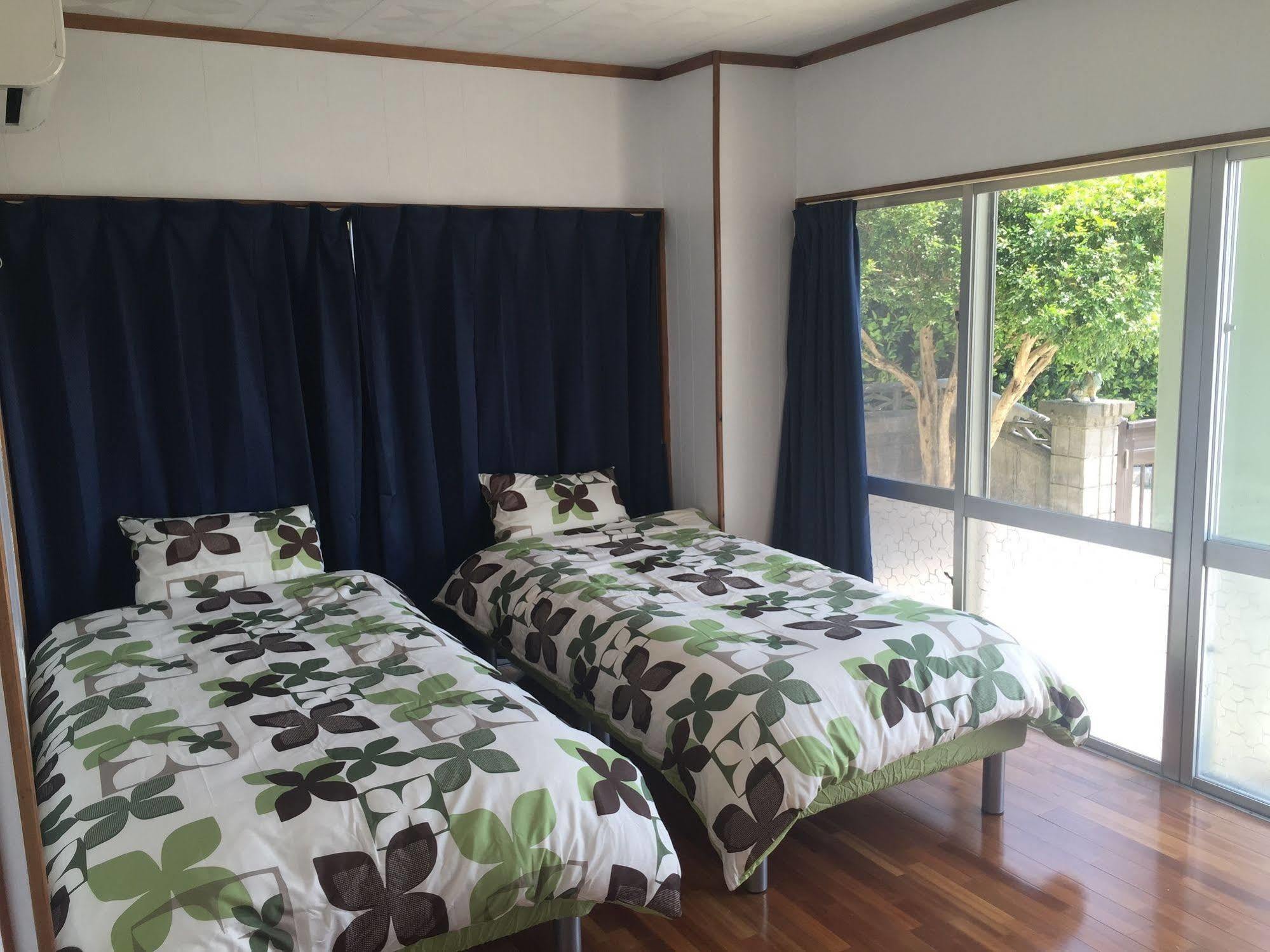 Guesthouse Seagull Village Motobu Exterior photo